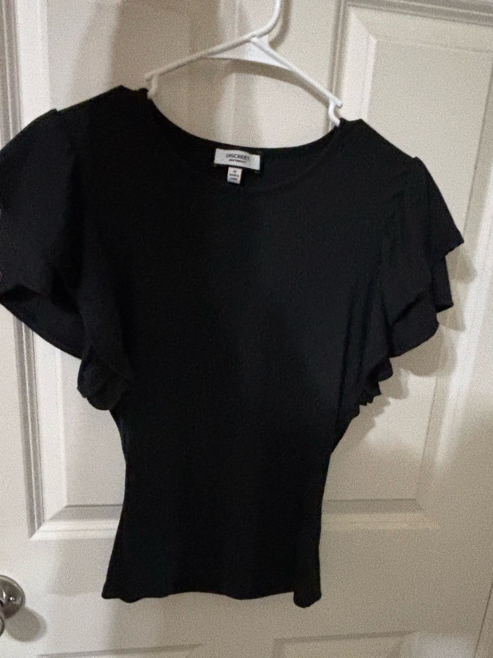 Black ribbed, discreet New York City blouse. Medium
